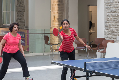 Sivayini hitting the ball as Bushra waits for the return