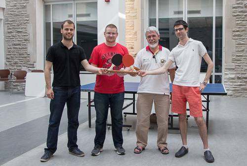 The two winning teams share the tournament trophy which was designed and constructed by Frank and Brian in the machine shop.