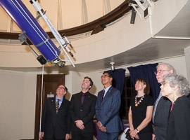 Honored guests view telescopes.